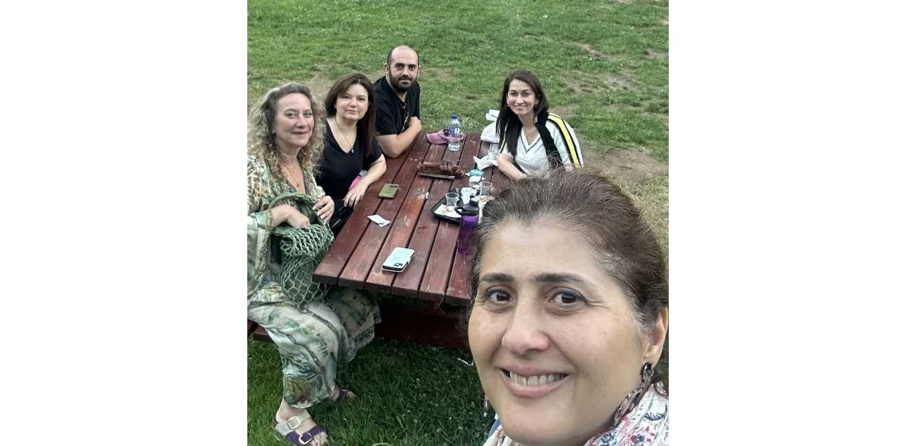 Group picture of members of the Istanbul Spirituality and Wellness Group in the park